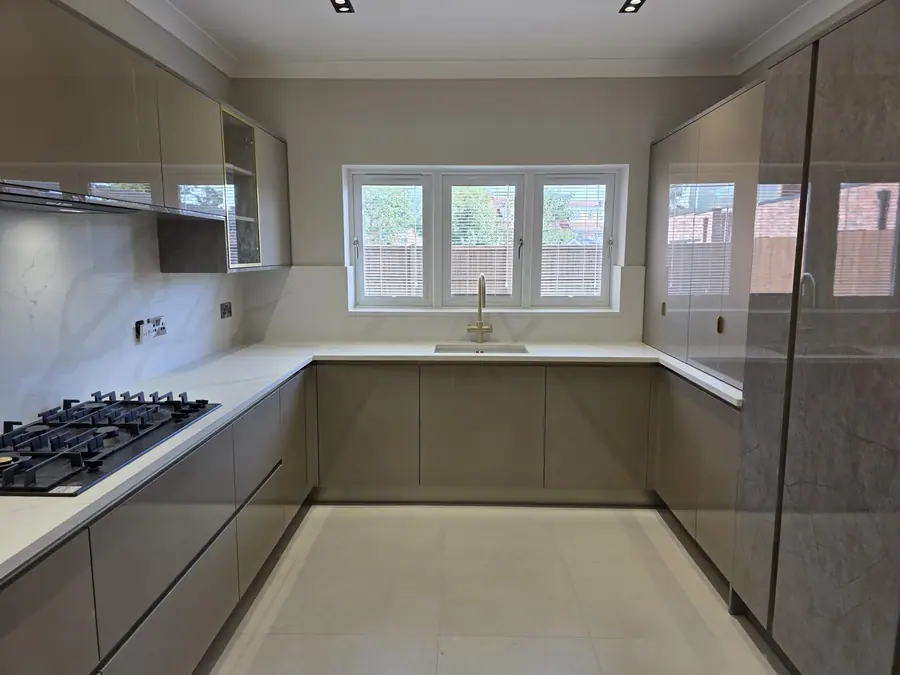 Taupe kitchen with a stone worktop