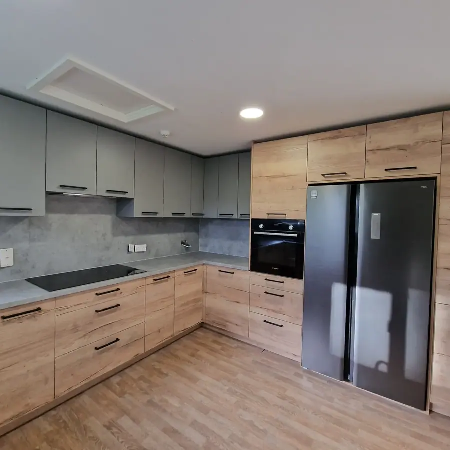 Grey and oak kitchen fitted wall to wall