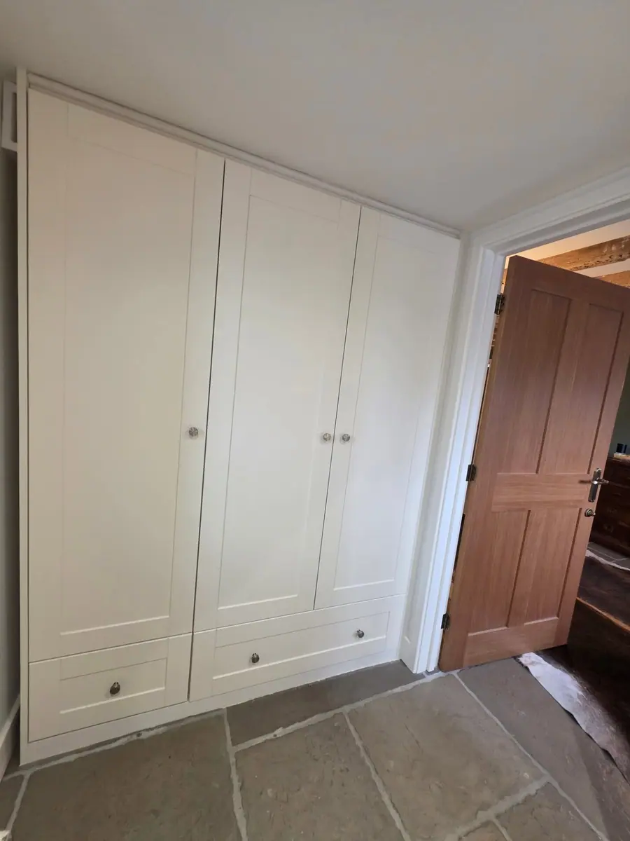 White shaker wardrobes with drawers below