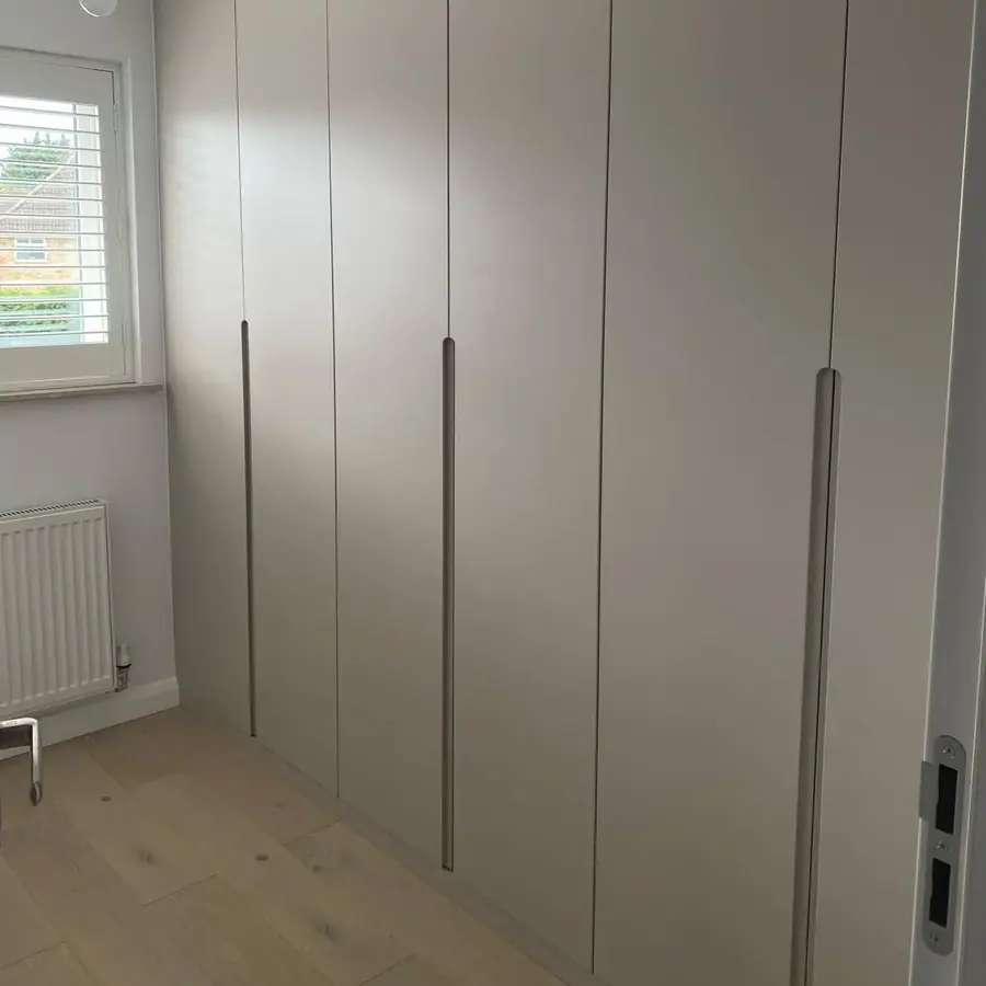 Grey slab wardrobe with long black handles