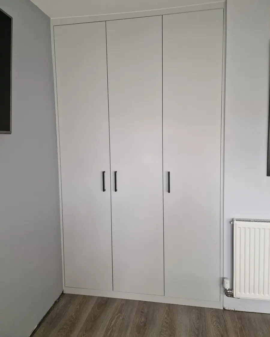 White three-door fitted wardrobe
